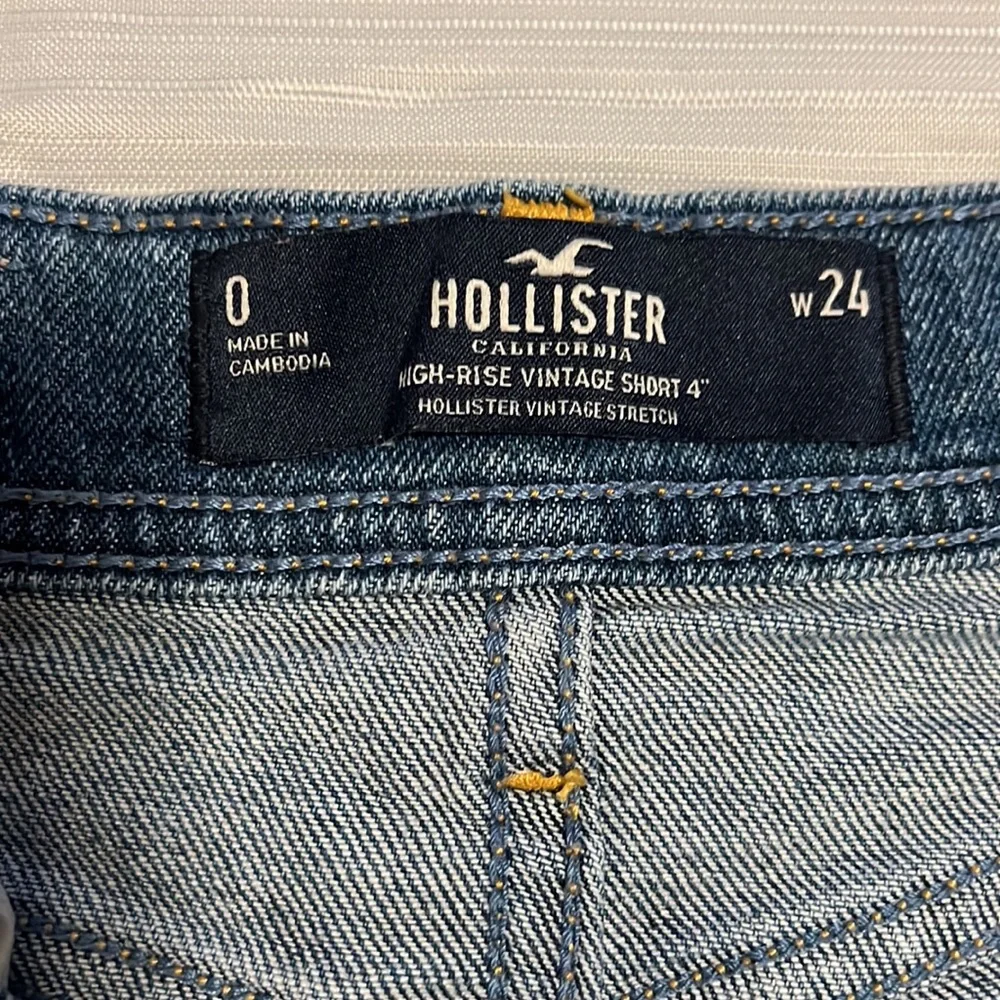 Hollister high rise vintage distressed jean shorts with sunflowers. - Picture 3 of 3